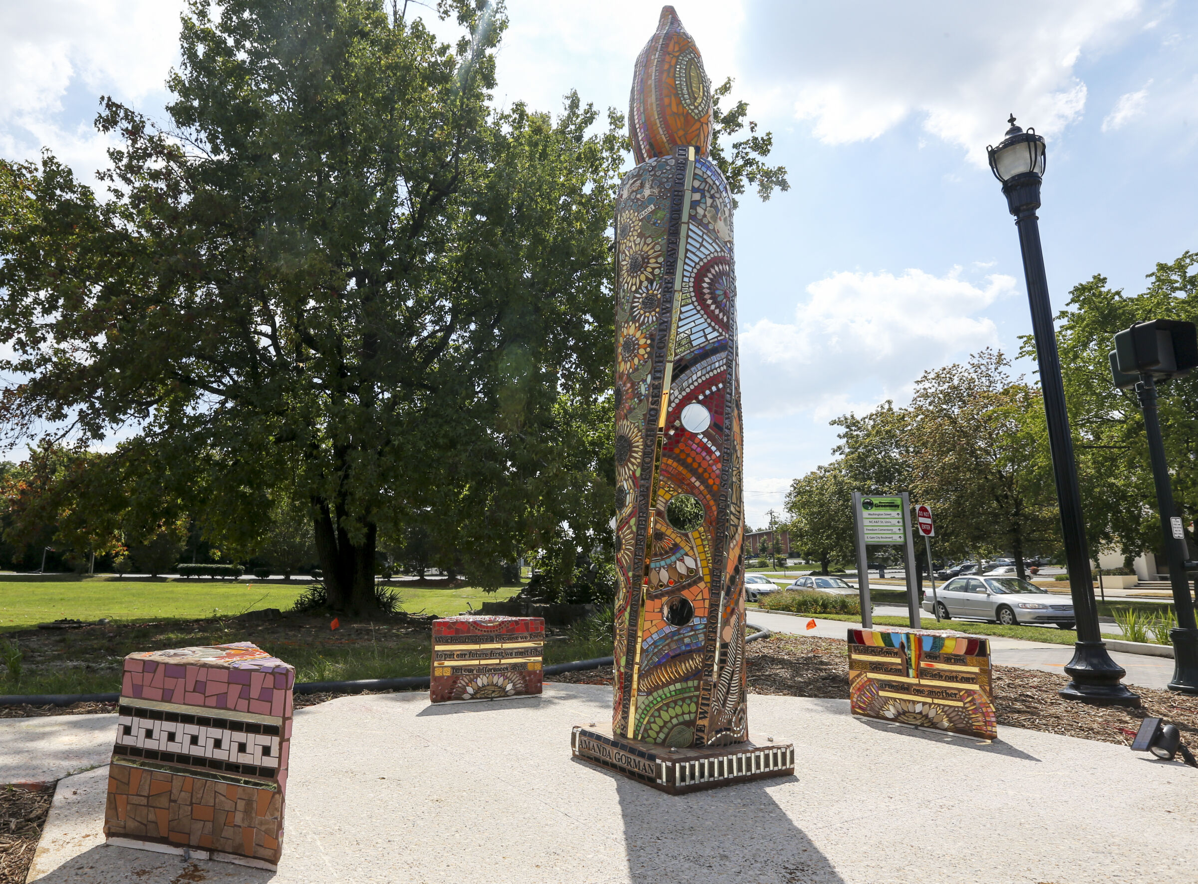 Mosaic candle sculpture along Downtown Greenway