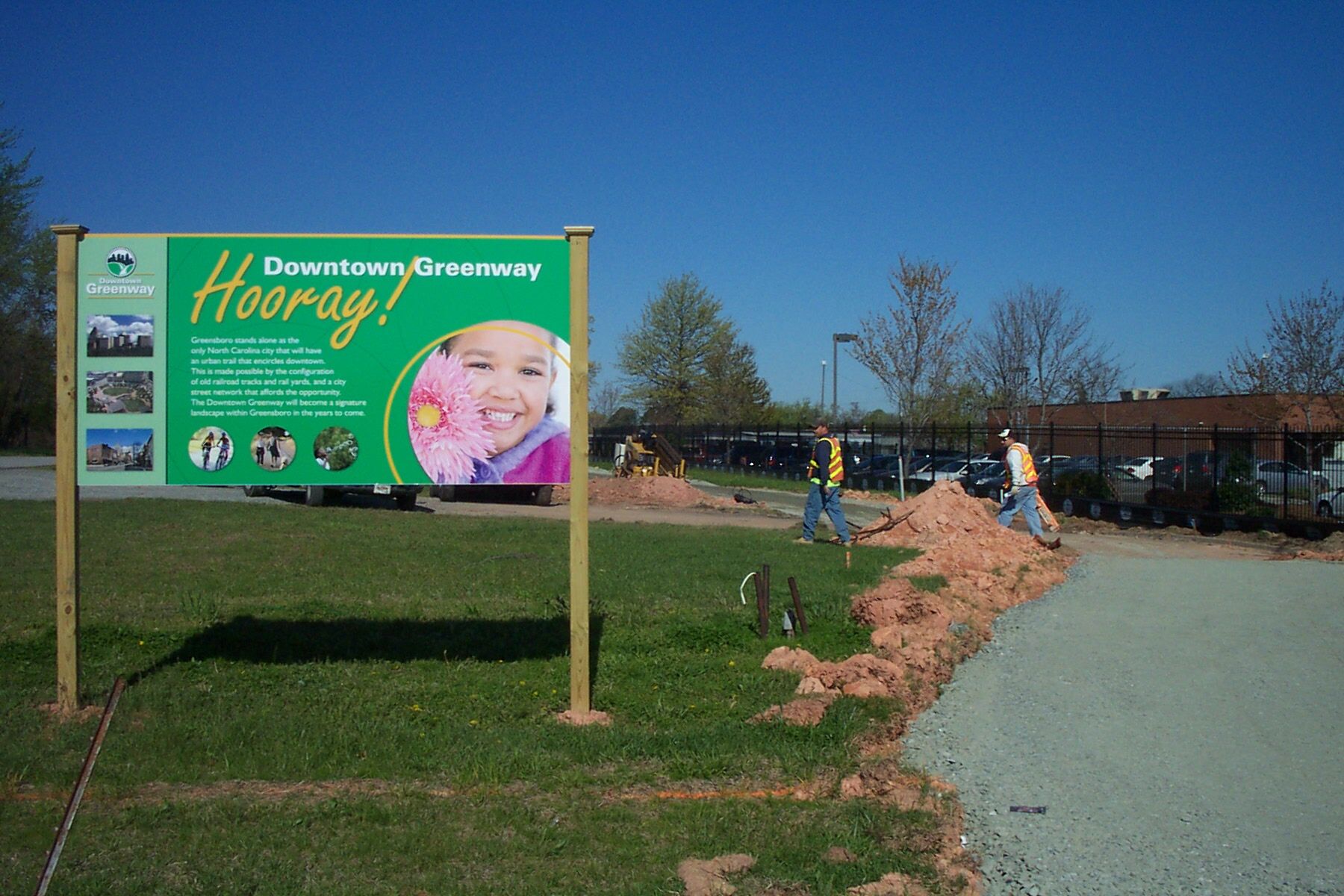 Groundbreaking sign along Downtown Greenway in Greensboro