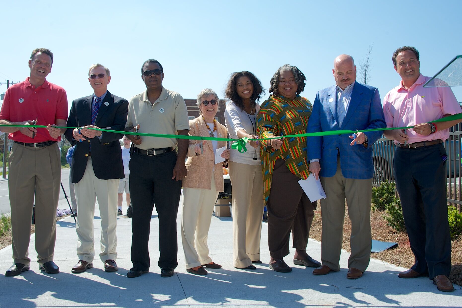 Ribbon cutting ceremony with community leaders along Downtown Greenway in Greensboro