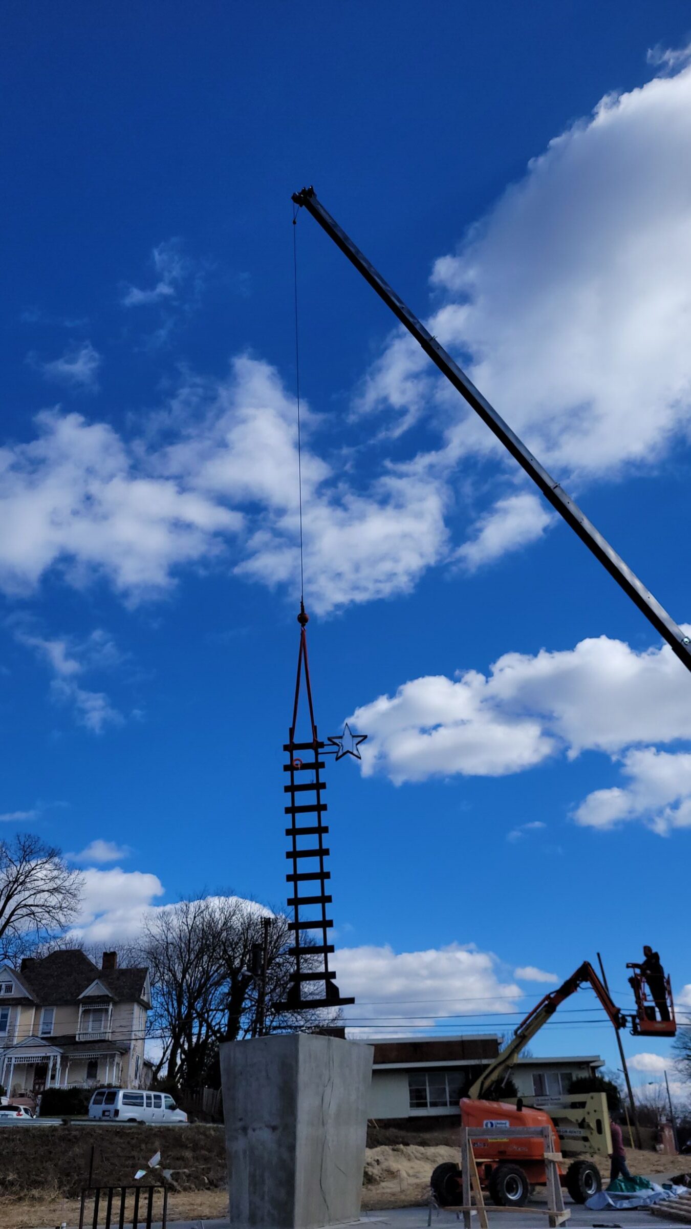 Installation of sculpture Freedom Cornerstone along Downtown Greenway.