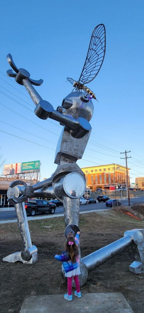 Large metal robot sculpture along the Downtown Greenway trail in Greensboro